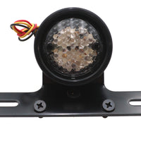 33-8232 - Drilled Black Bezel Tail Lamp by Ultima