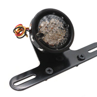 33-8232 - Drilled Black Bezel Tail Lamp by Ultima